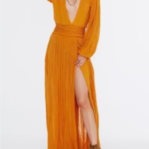 Long sleeve Burnt orange dress. Splits up sides with belt tie